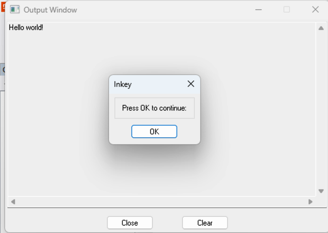 DataFlex Windows Output Window showing "Hello world!" with the Inkey "Press OK to continue" dialog